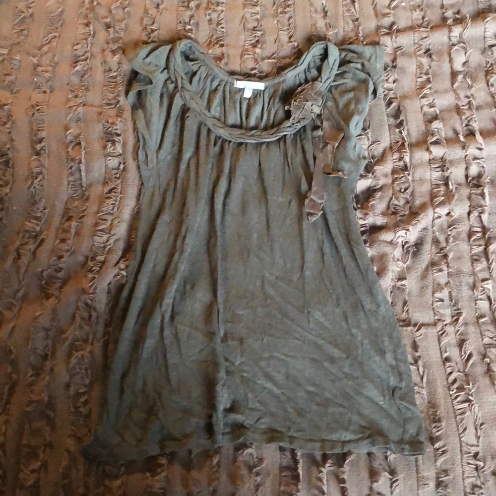 gray top with two small roses on left shoulder